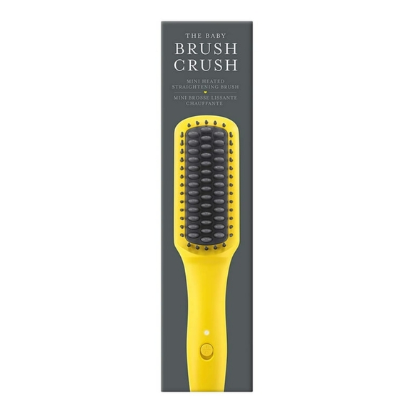 The Drybar Baby Brush Crush Mini Heated Straightening Brush is compact and has a - Picture 4 of 5